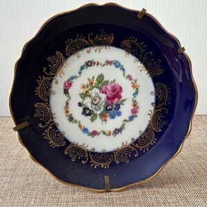 Limoges made in France, small round plate, blue, gold trim, floral design.